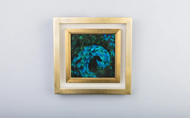 Blue wave painting made from natural peacock feathers in blue and blue/green on the front